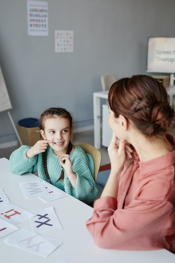 Girl studying with teacher